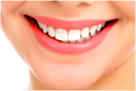 The perfect smile of a woman with white teeth and pink lips, thanks to the top-notch Cosmetic Dentistry in Indore.